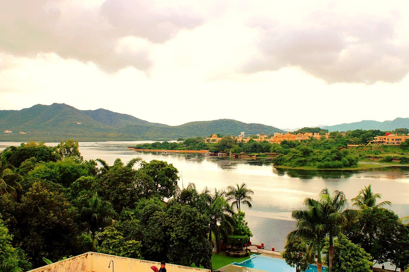 Still green water and low hills at Badi Lake